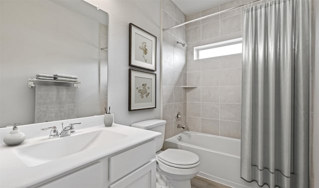 full bathroom featuring vanity, toilet, and shower / bathtub combination with curtain