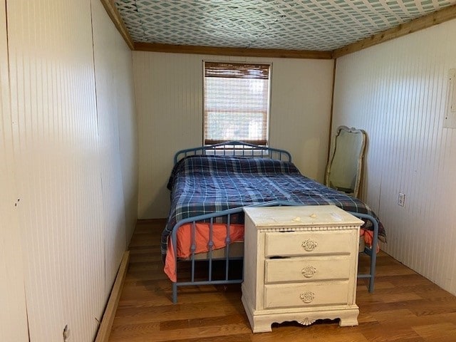 381 Center St, Matagorda, TX 77457 - bedroom featuring wood finished floors and crown molding