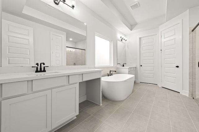 bathroom featuring vanity, tile patterned floors, and shower with separate bathtub