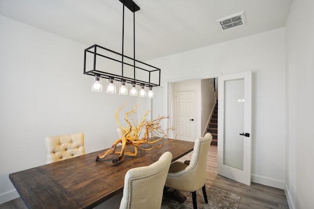 dining space featuring dark hardwood / wood-style floors