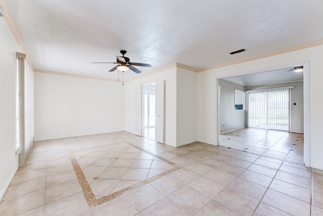 tiled spare room featuring ceiling fan and ornamental molding