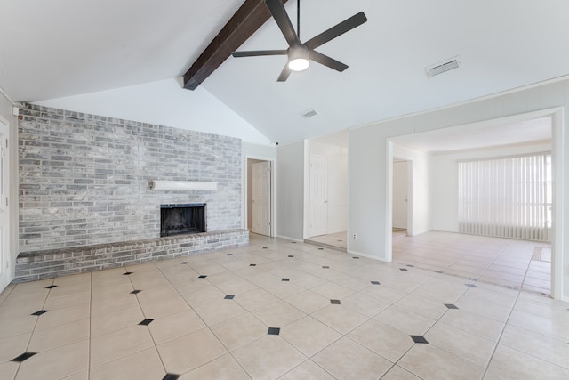 unfurnished living room with lofted ceiling with beams, light tile patterned floors, a brick fireplace, ceiling fan, and brick wall