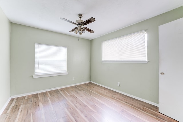 unfurnished room with ceiling fan, a healthy amount of sunlight, and light hardwood / wood-style flooring