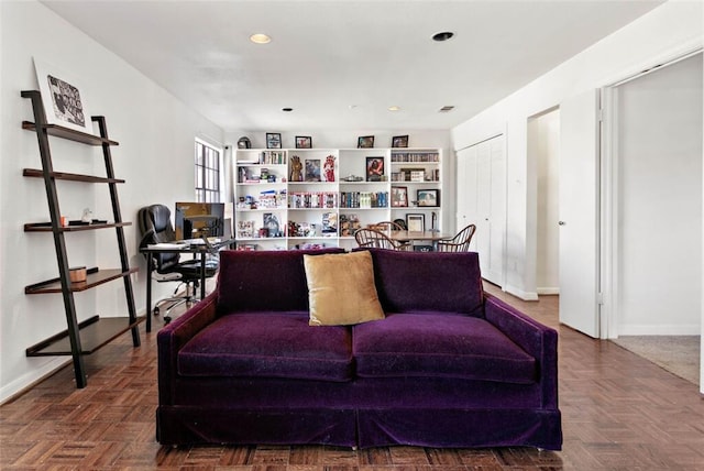 living room featuring parquet flooring