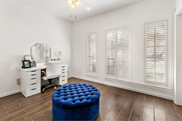 office space with ceiling fan, plenty of natural light, and dark hardwood / wood-style flooring