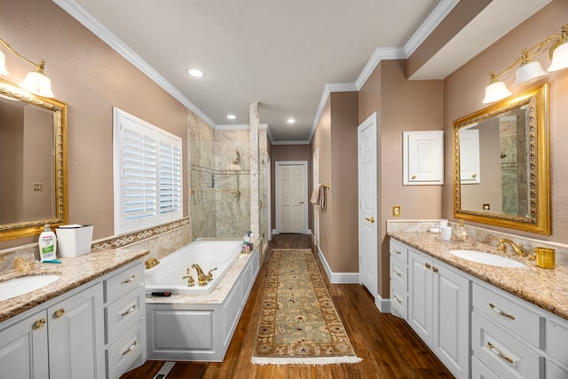 bathroom featuring wood-type flooring, vanity, shower with separate bathtub, and crown molding