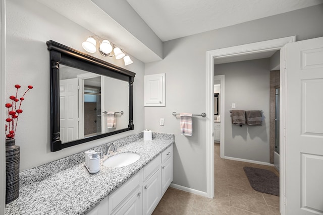 bathroom featuring tile patterned floors, vanity, and shower / bath combination