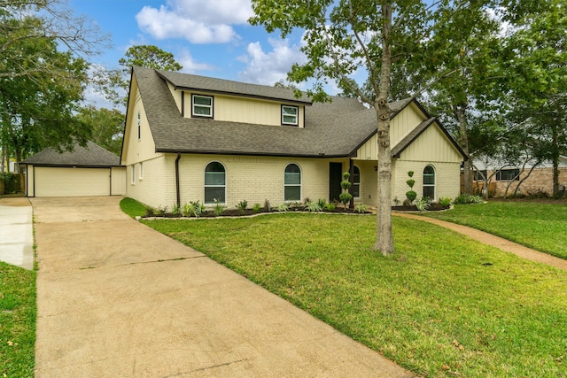 view of front of house featuring a front lawn and a garage