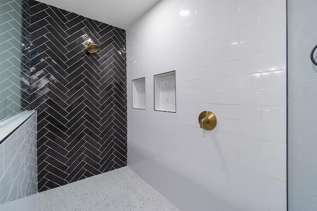 bathroom featuring tiled shower