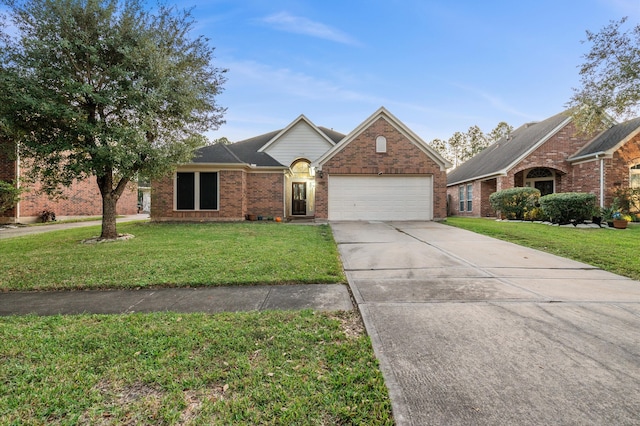 front facade featuring a garage and a front lawn