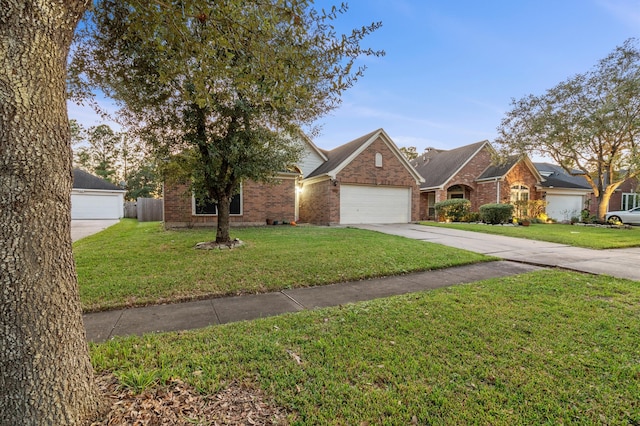 view of front facade featuring a garage and a front lawn