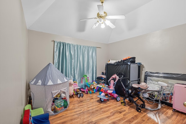 game room featuring lofted ceiling, wood-type flooring, and ceiling fan