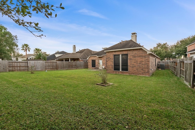 view of yard featuring central AC