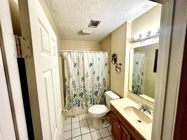 bathroom with vanity, tile patterned floors, a shower with curtain, toilet, and a textured ceiling