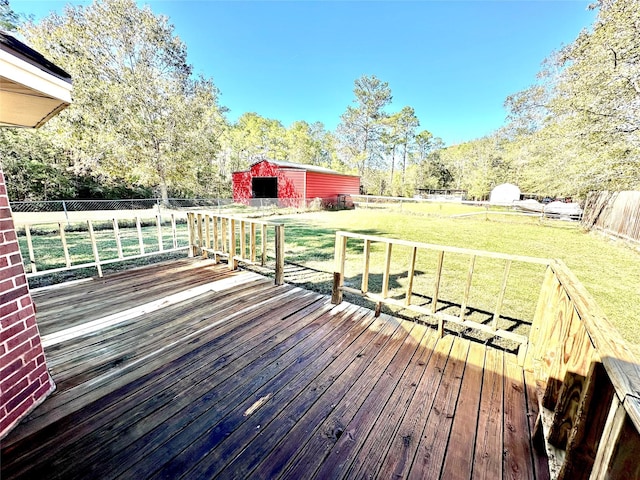 deck with a lawn and an outbuilding