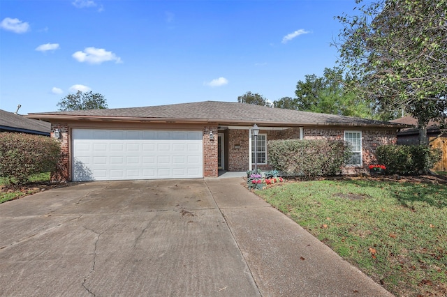 single story home featuring a front yard and a garage