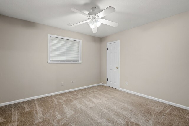 unfurnished room with light carpet and ceiling fan