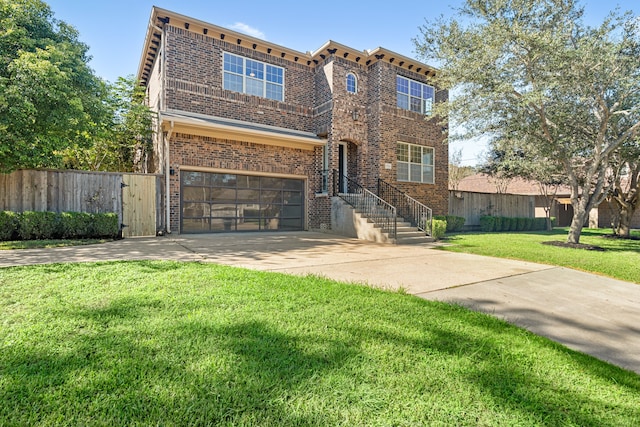 view of front of home featuring an attached garage, brick siding, fence, and a front lawn