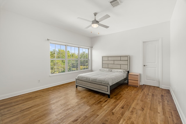 bedroom with ceiling fan and light hardwood / wood-style floors