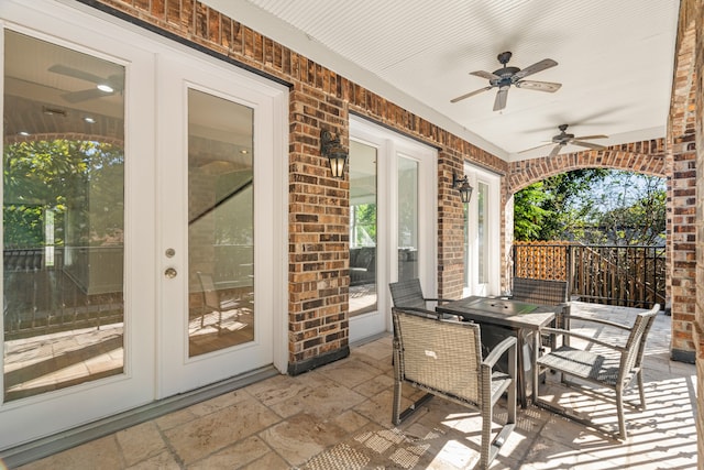 view of patio / terrace featuring ceiling fan and french doors