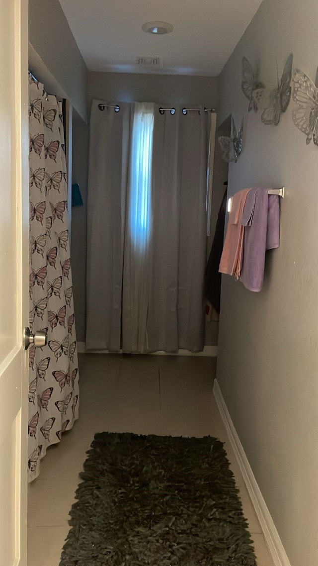 bathroom with tile patterned floors