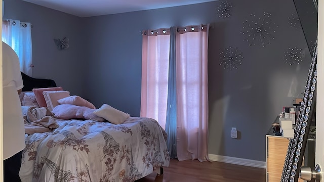 bedroom featuring wood-type flooring