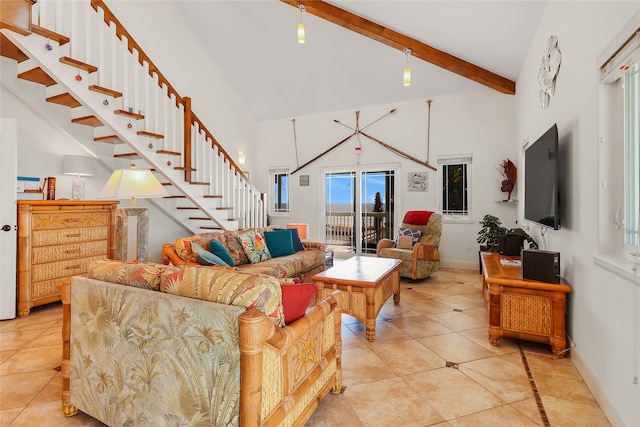 living room with beam ceiling, light tile patterned floors, and high vaulted ceiling