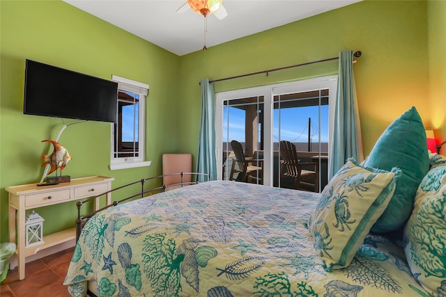 tiled bedroom featuring access to outside and ceiling fan