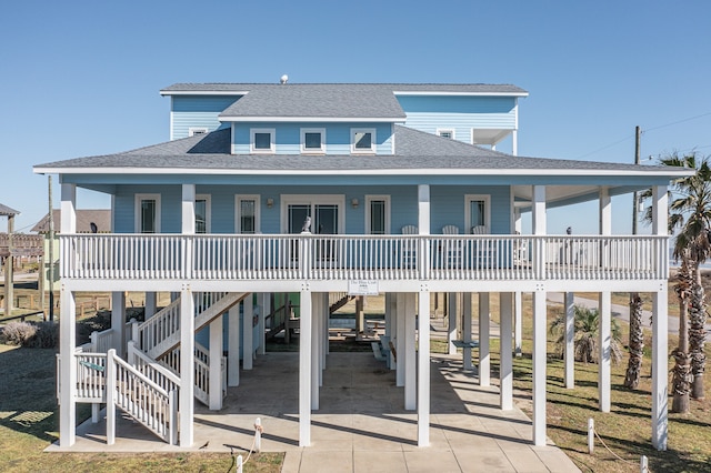 view of front of house featuring a porch and a carport