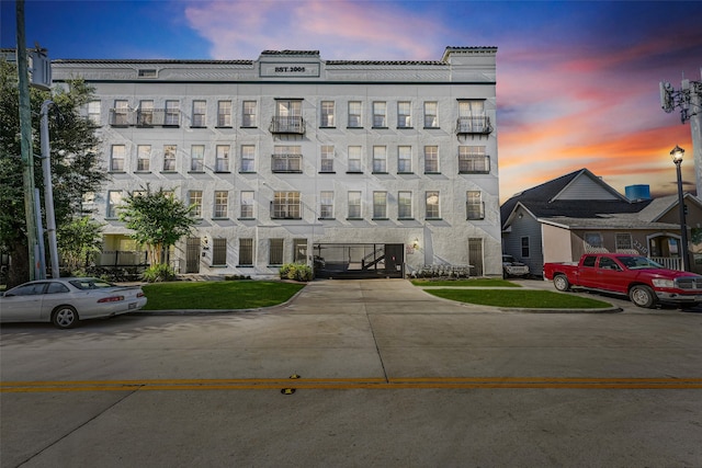 view of outdoor building at dusk