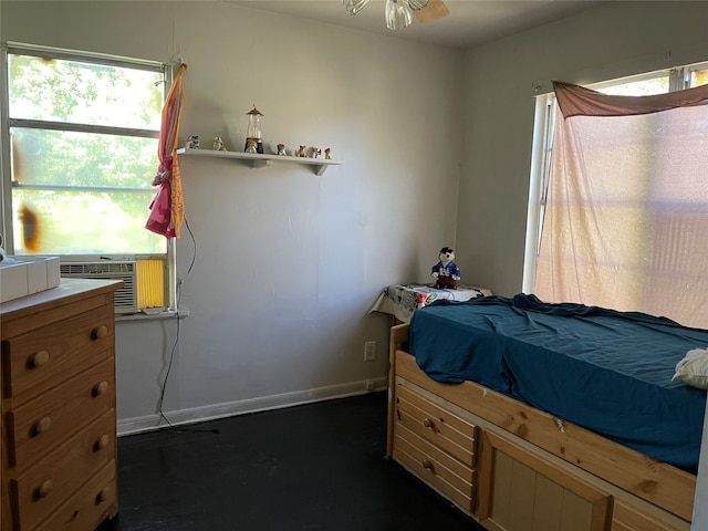 bedroom with cooling unit and ceiling fan