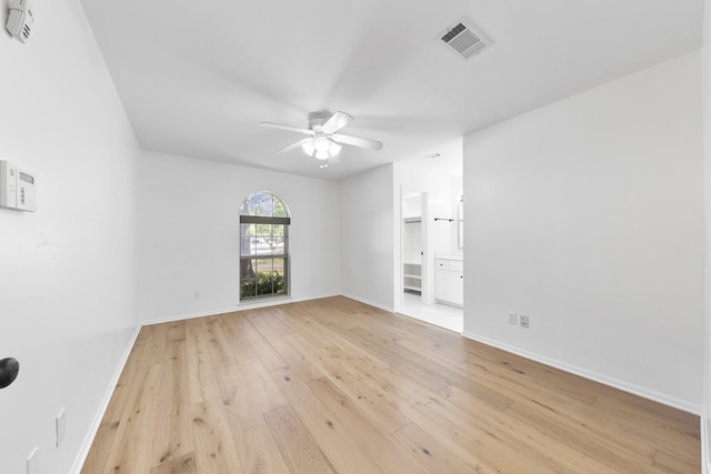 spare room with ceiling fan and light hardwood / wood-style floors