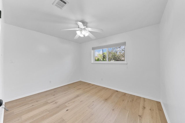 spare room featuring ceiling fan and light hardwood / wood-style flooring