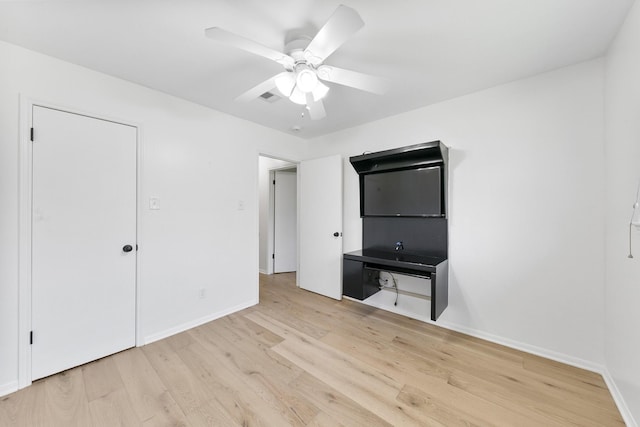 unfurnished bedroom with light wood-type flooring and ceiling fan