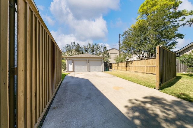 garage featuring a lawn