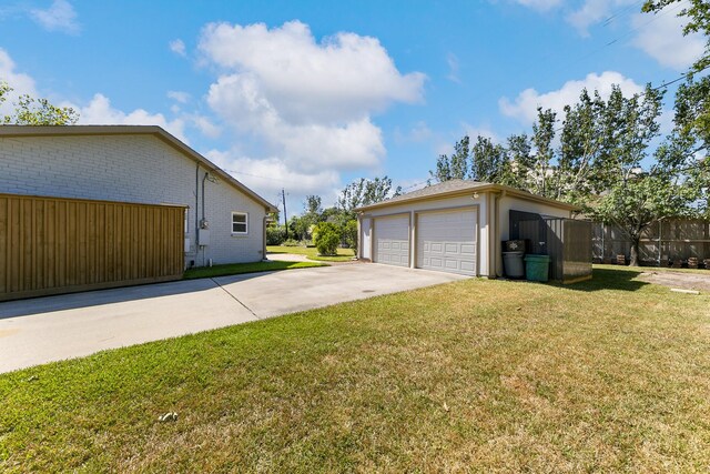 view of side of home featuring a yard and an outdoor structure