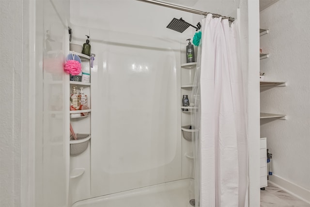 bathroom featuring a shower with curtain