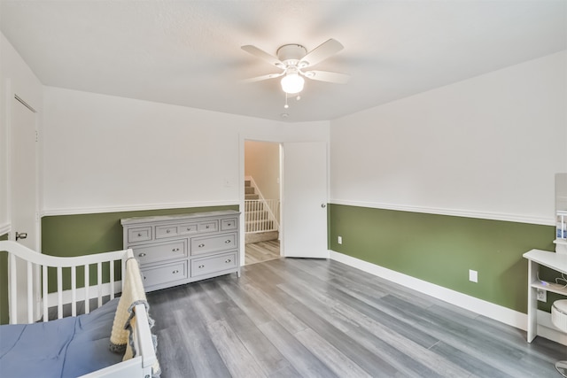 bedroom with hardwood / wood-style flooring and ceiling fan