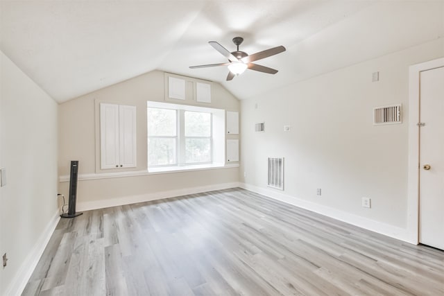 additional living space featuring ceiling fan, light wood-type flooring, and lofted ceiling