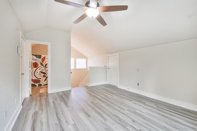 bonus room featuring light hardwood / wood-style floors, lofted ceiling, and ceiling fan