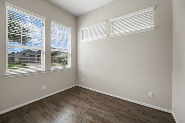 spare room featuring dark hardwood / wood-style floors