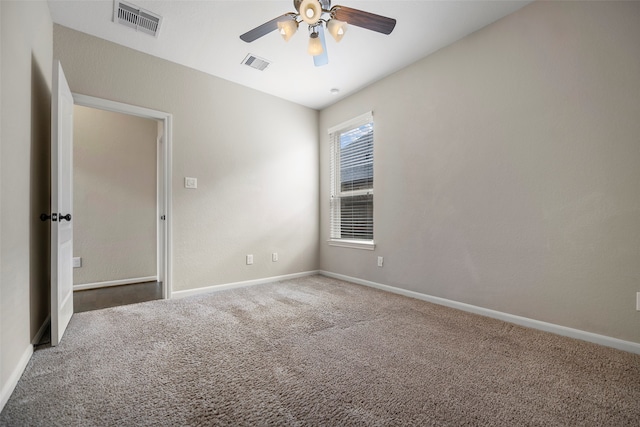 unfurnished room with ceiling fan and carpet flooring