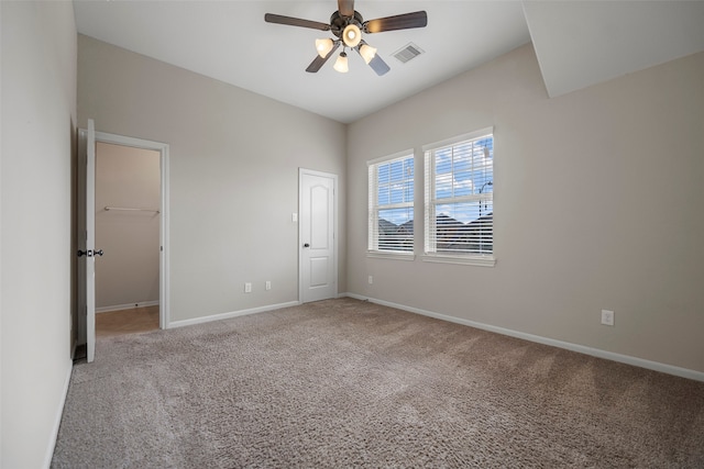 carpeted empty room featuring ceiling fan