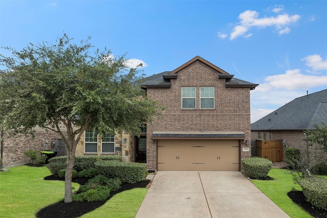 view of front of house with a garage and a front yard