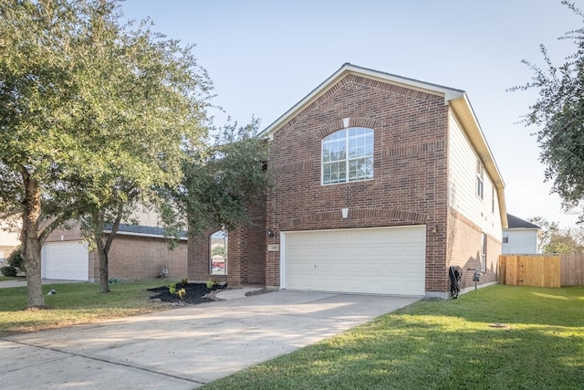 view of property featuring a garage and a front yard