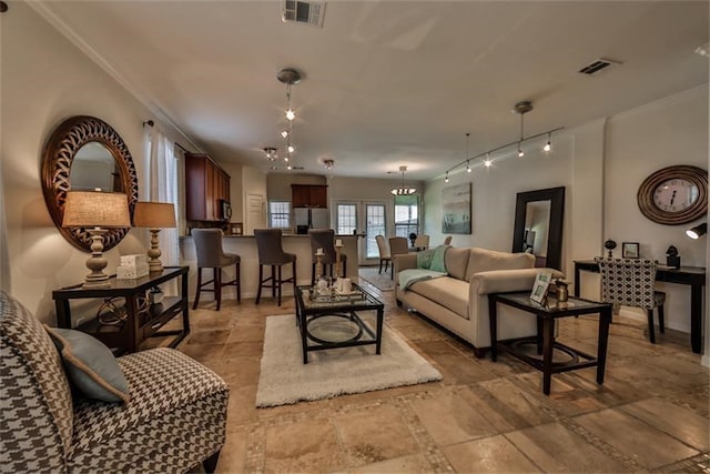 living room featuring french doors and ornamental molding