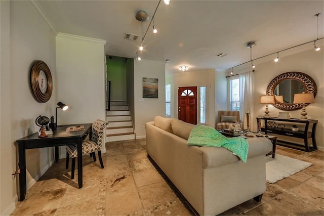 living room with rail lighting and crown molding