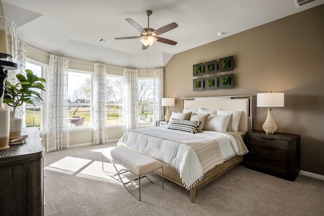 bedroom with ceiling fan and light colored carpet