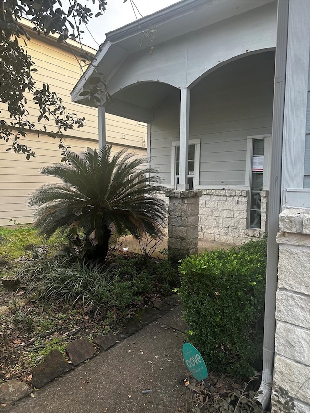 view of side of property featuring a porch