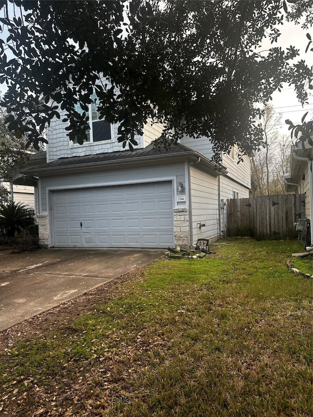 garage featuring a yard